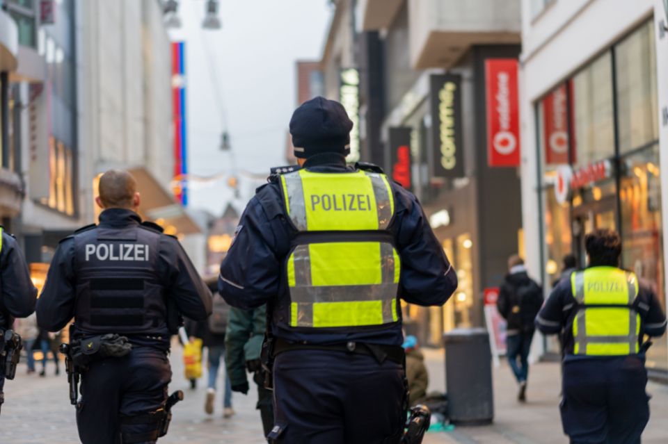 Police officers walking in a busy street