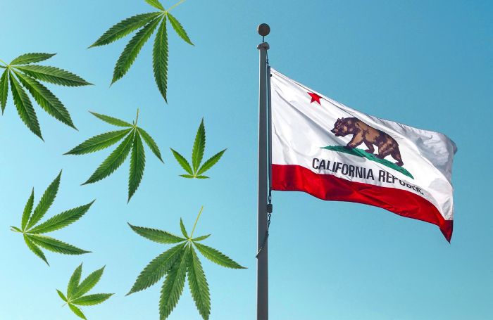 Waving flag of California and cannabis leaves