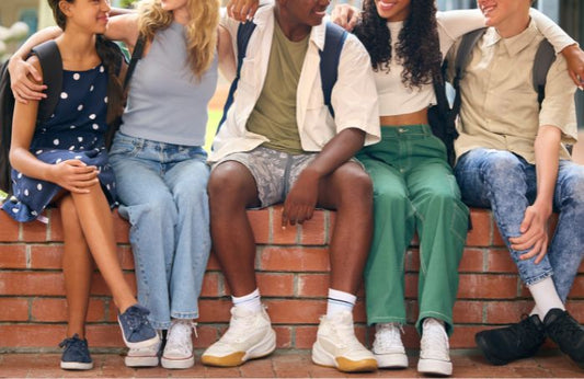 A group of teenagers talking to each other