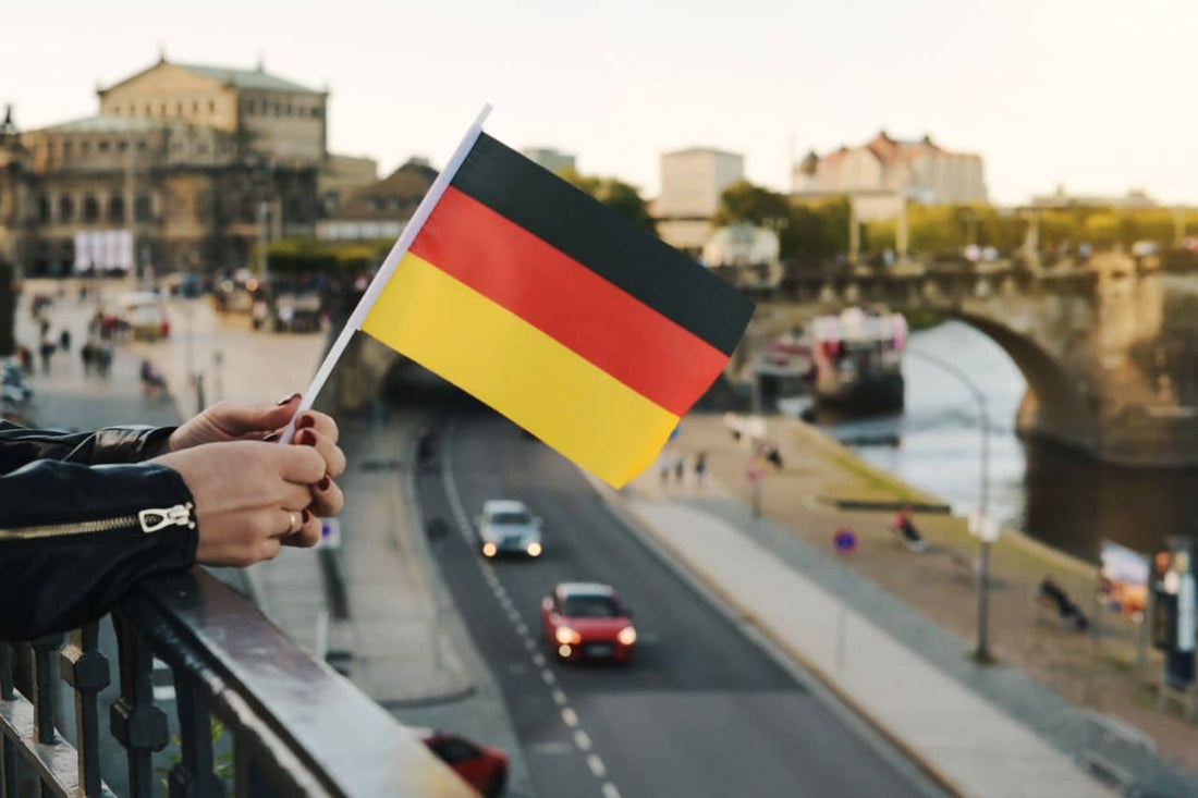 A woman holds a German flag