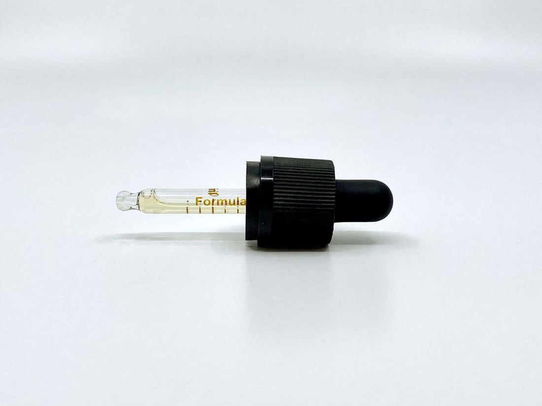 Formula Swiss CBD oil dropper with measuring marks on a white background