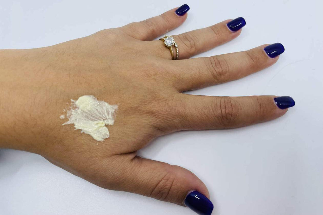 A small amount of CBD cream on the back of a hand, before it is rubbed in